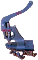 buttonpressingmachinecopy.jpg (12923 bytes)